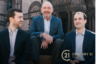 the Bray family smiles together. All three men are wearing suits. Century 21 Cityside logo in bottom right