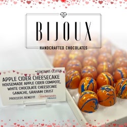 Apple Cider Cheesecake bonbons in a display case