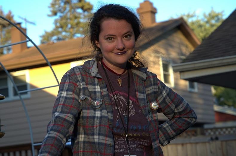 Anna Goldberg in flannel shirt smiling