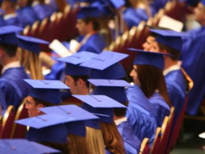 Students at graduation ceremony with cap and gown