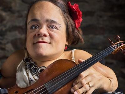 Gaelynn Lea holding a violin