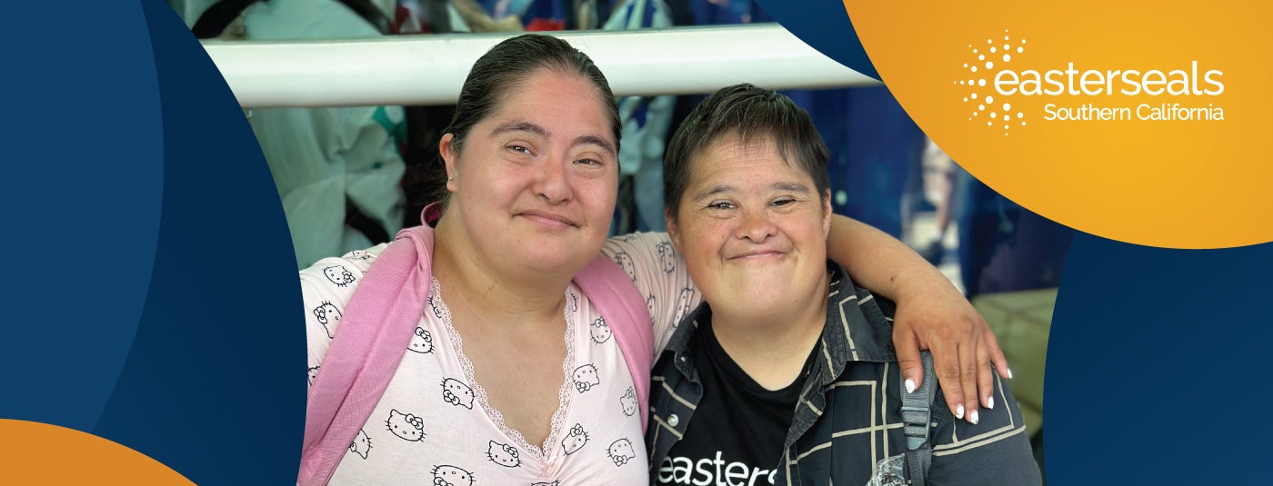 Two Easterseals participants smiling with their arms around each other